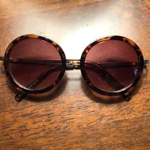 Round dark tortoise shell sunglasses